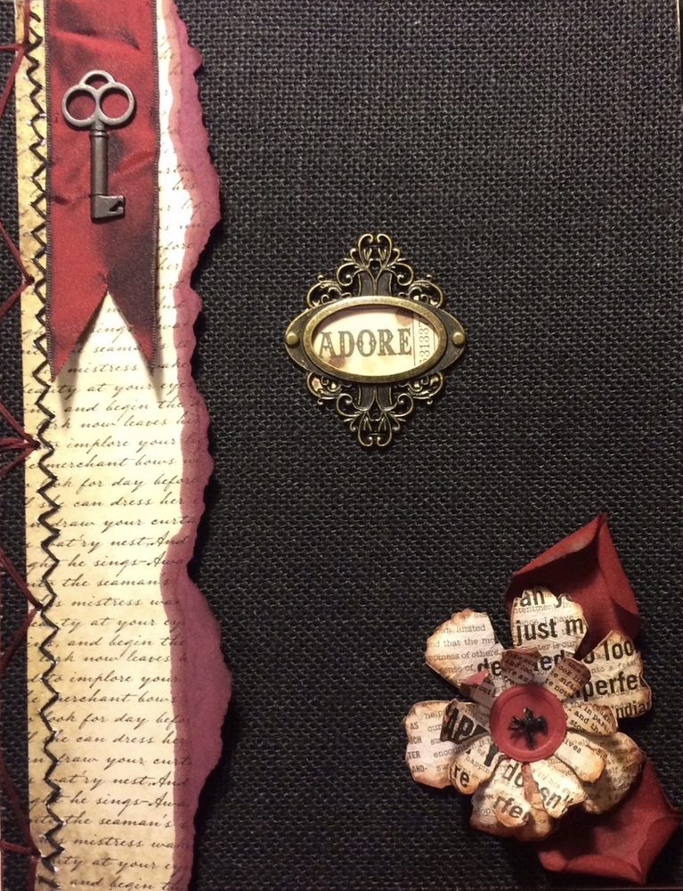 Journal cover with a skeleton key, brass plaque and paper flower